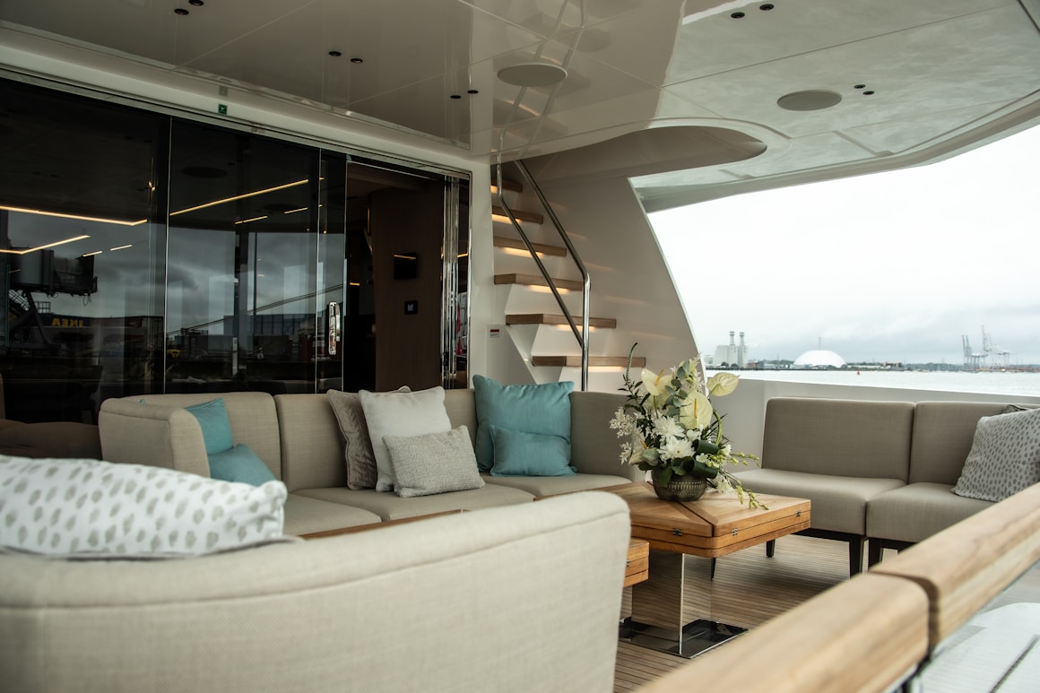 Luxury yacht outdoor lounge with premium seating and high-end maritime interior finish
